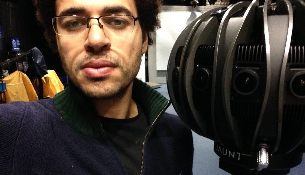 Mo beside a round Jaunt 360 camera rig, its lenses pointing every way.