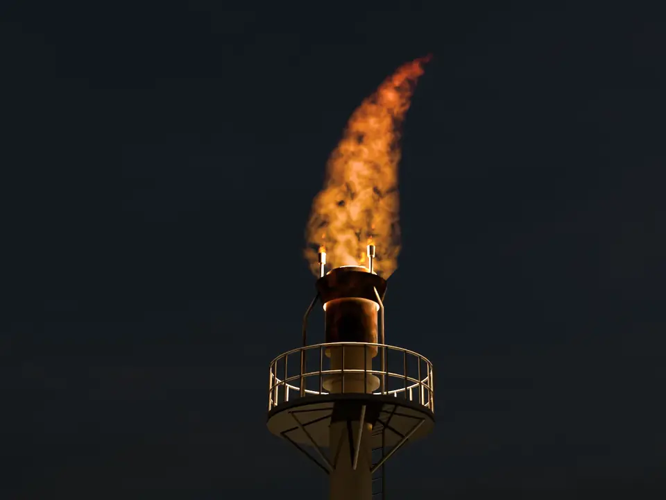 Flare stack head at night with the flare lit above three pilots