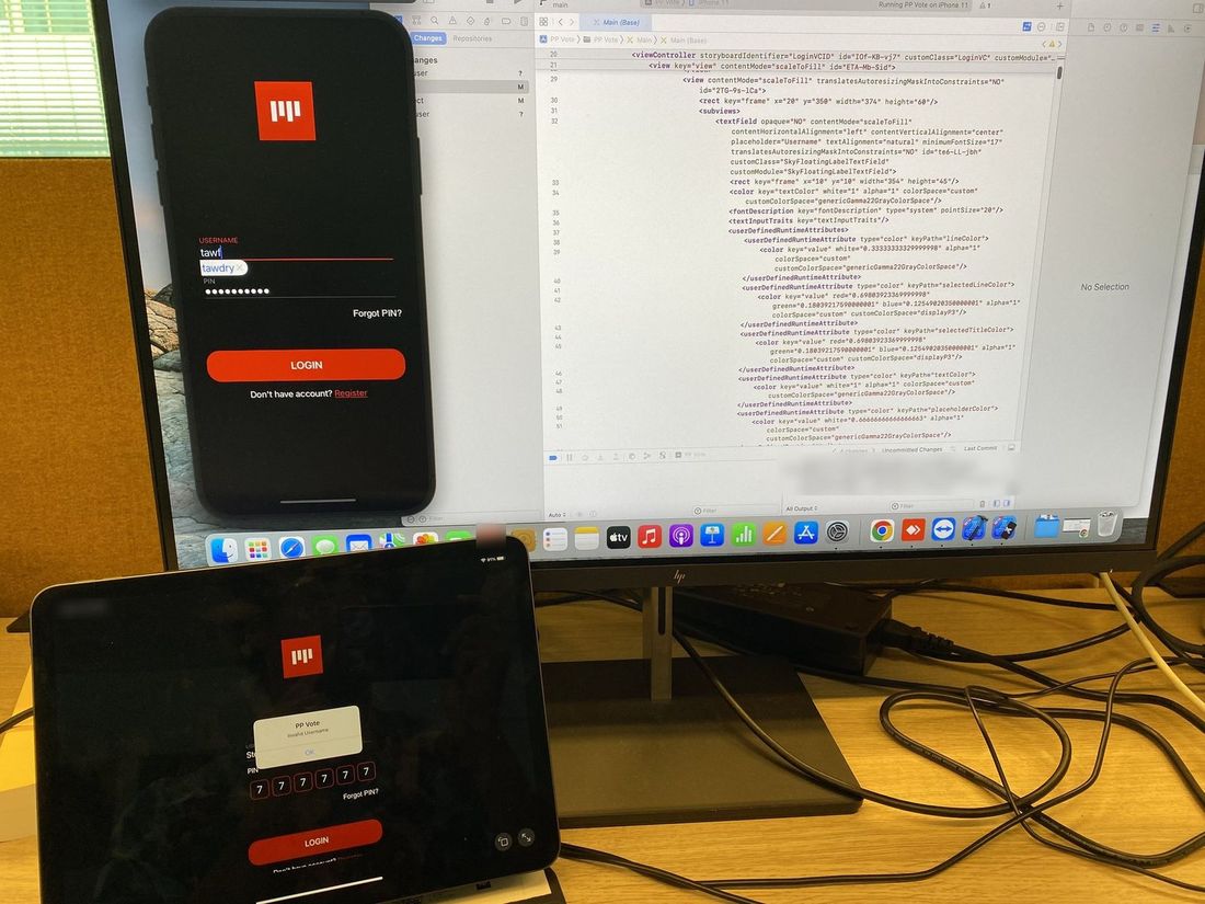 An iPhone and an iPad on a desk in front of a monitor showing Xcode. Both run the PP Vote login screen: a username, a PIN, Forgot PIN and a red Login button.